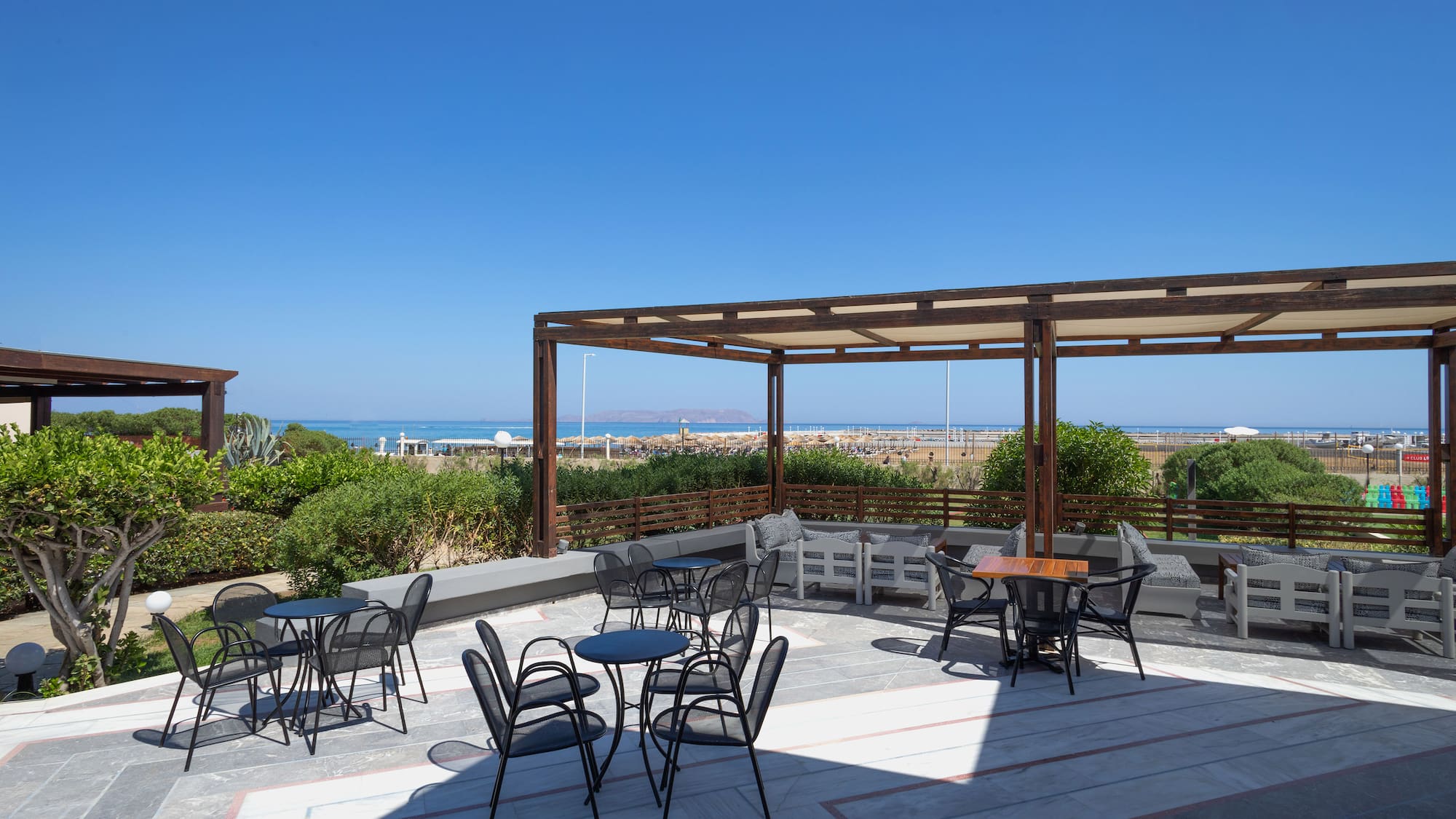 a patio with chairs and tables
