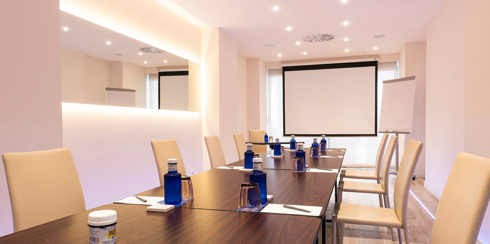 a conference room with a table and chairs