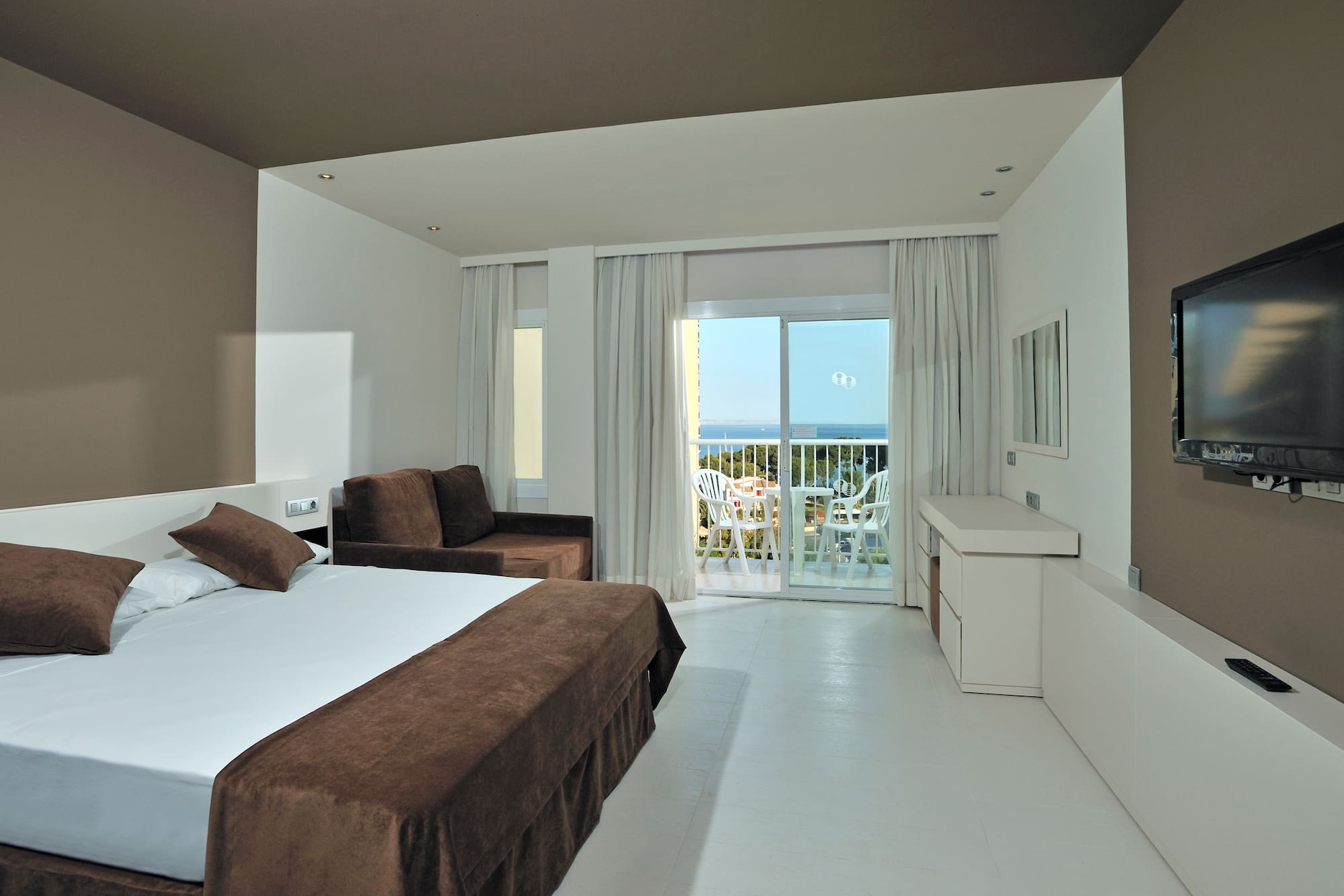 a room with a bed and a couch