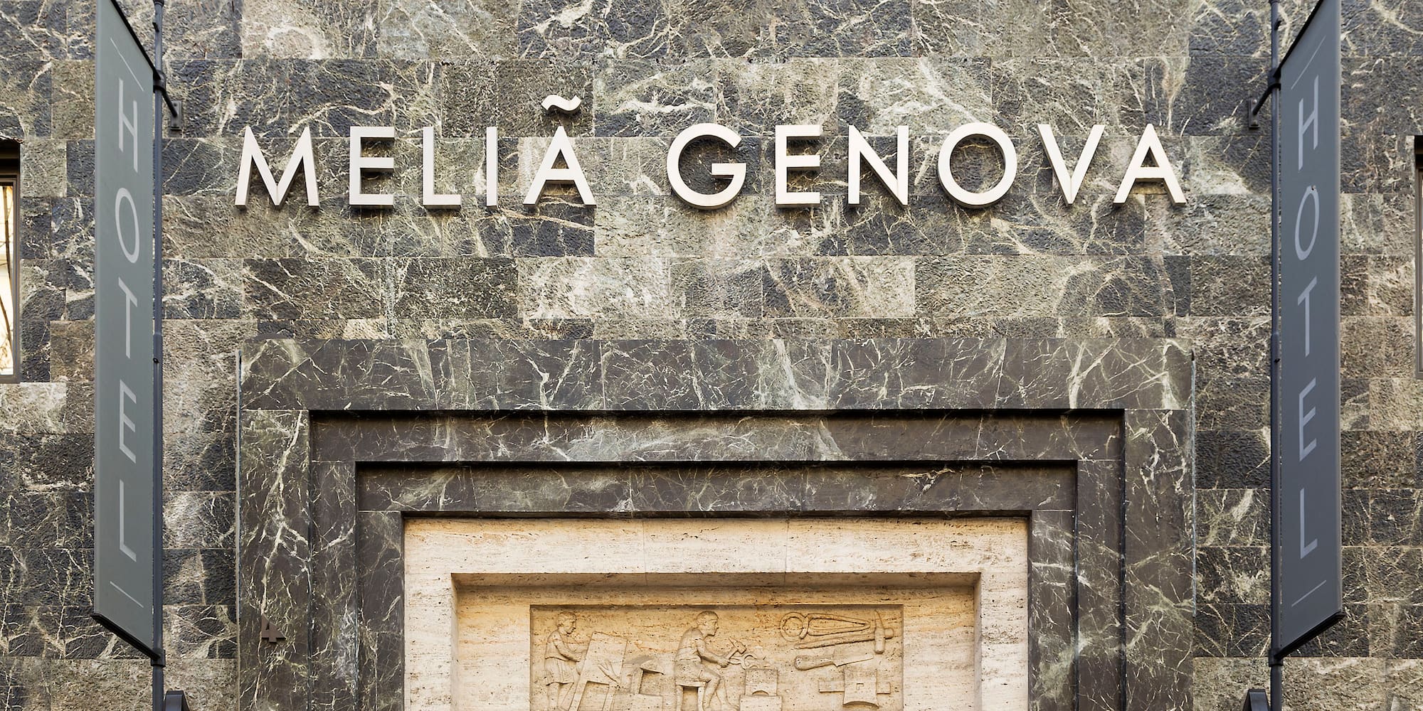 a stone building with a sign