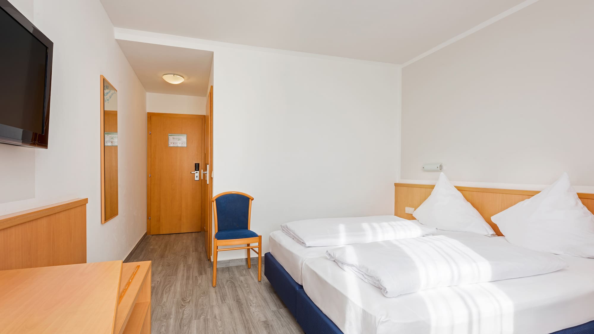 a room with a bed and a chair