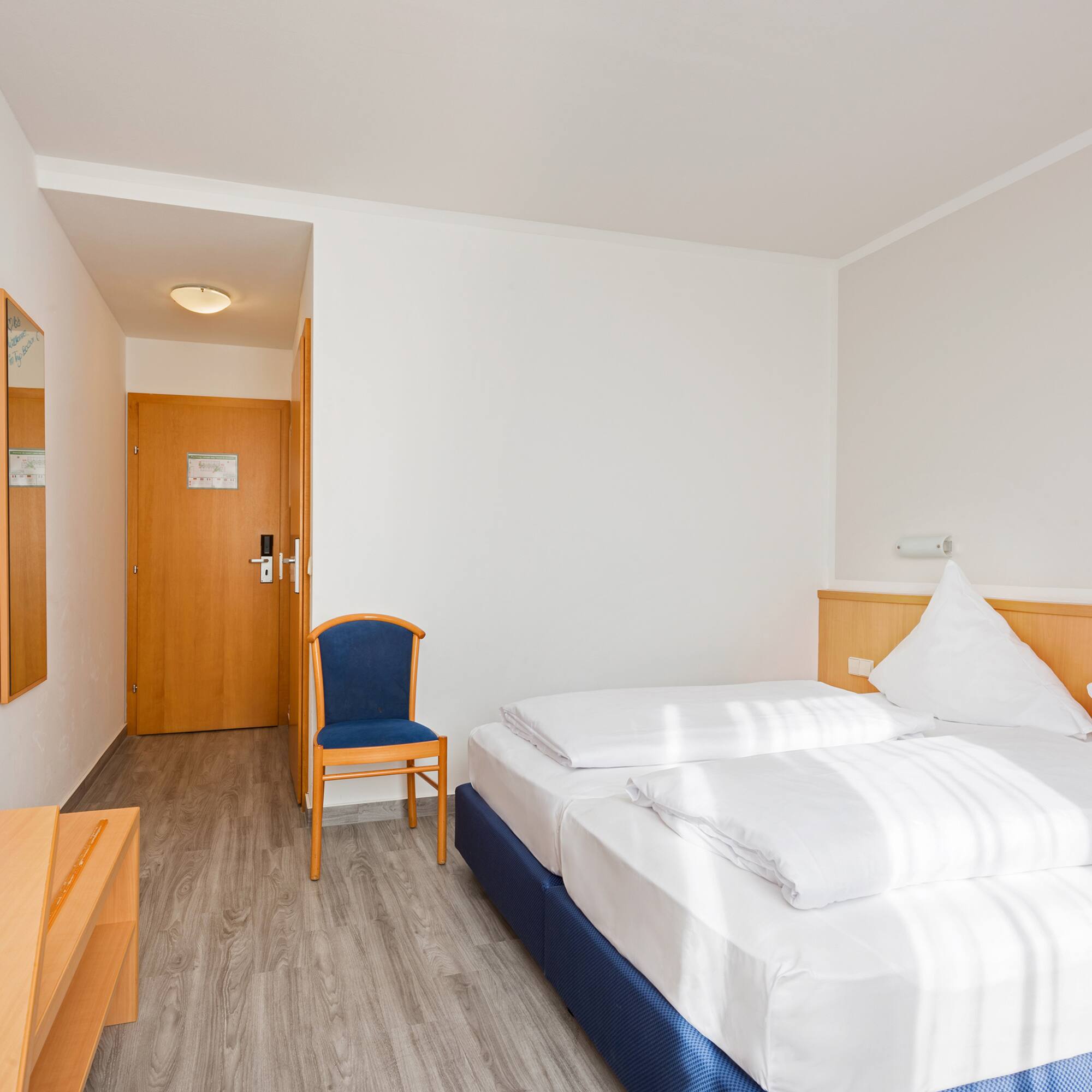 a room with a bed and a chair