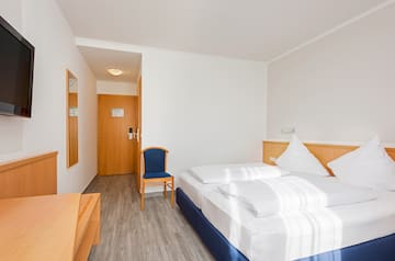 a room with a bed and a chair