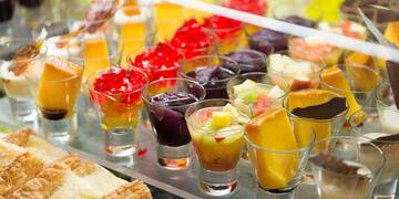 a group of glasses of fruit and jelly
