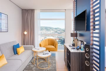 a room with a couch and a tv