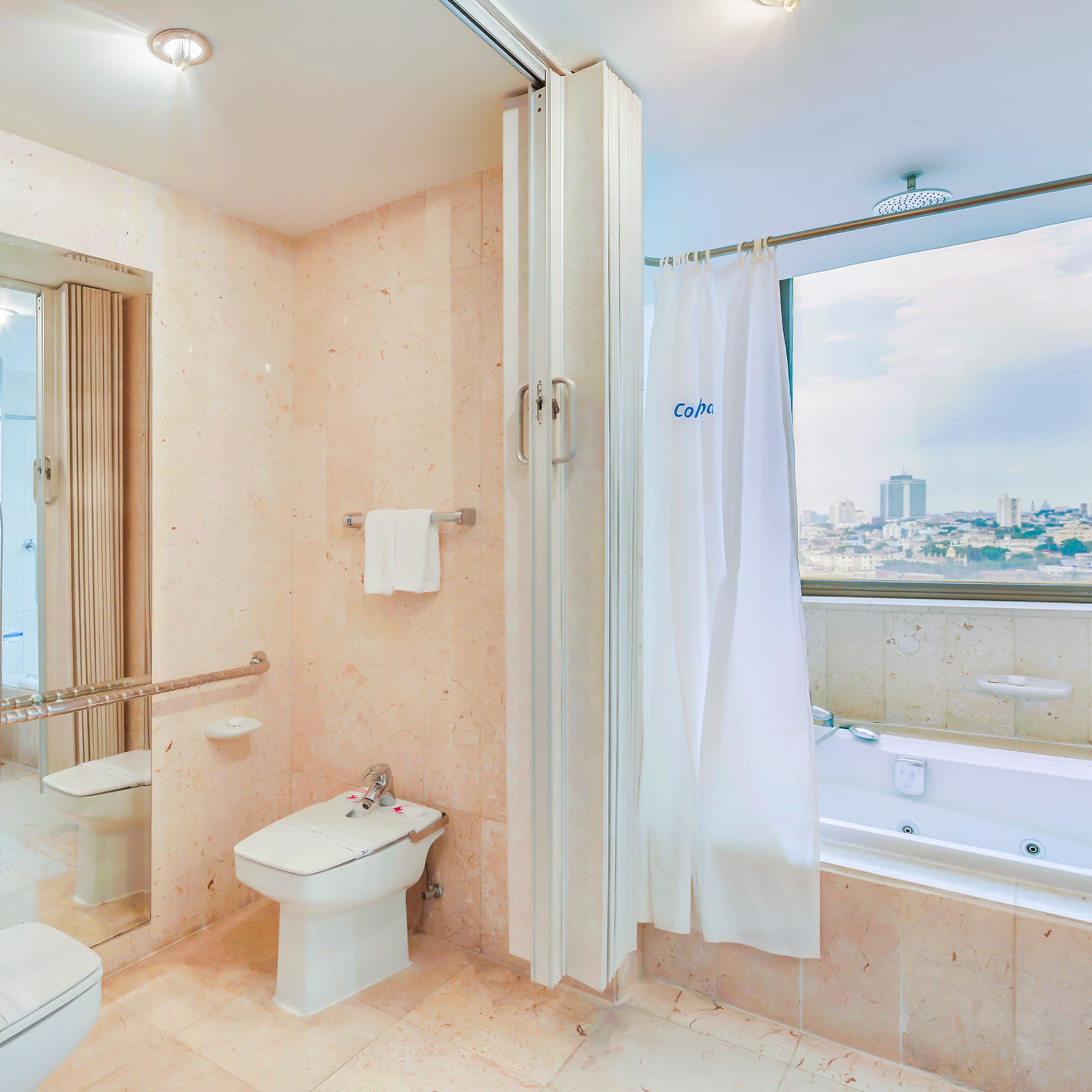 a bathroom with a bathtub and shower