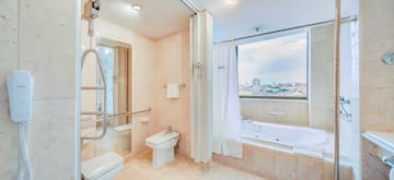 a bathroom with a bathtub and shower