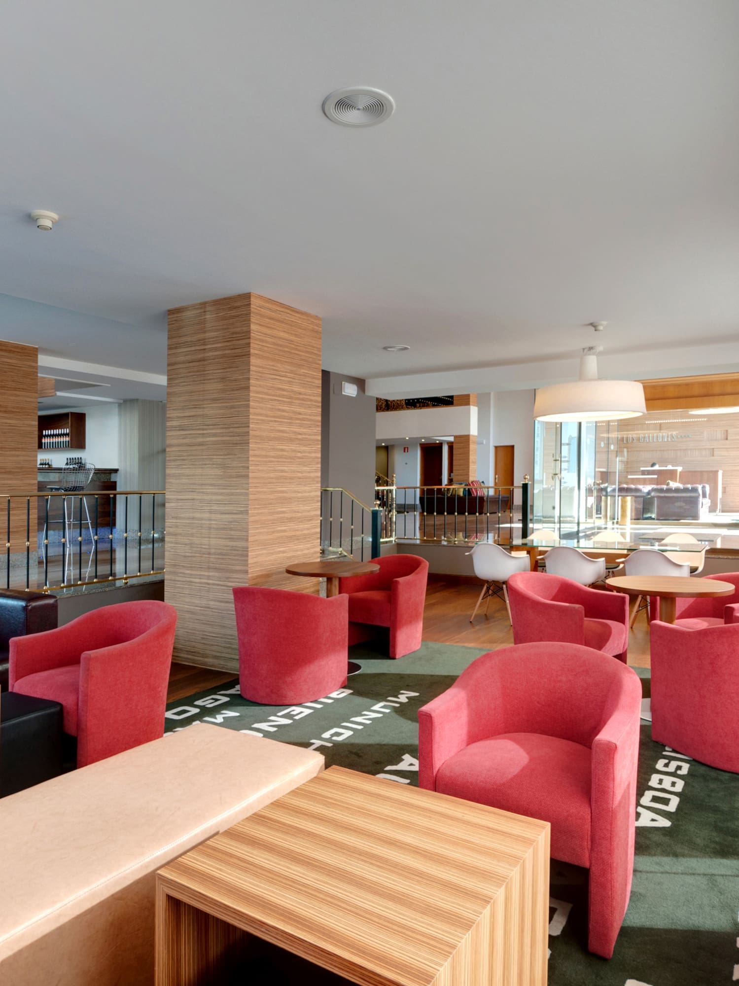 a room with red chairs and tables