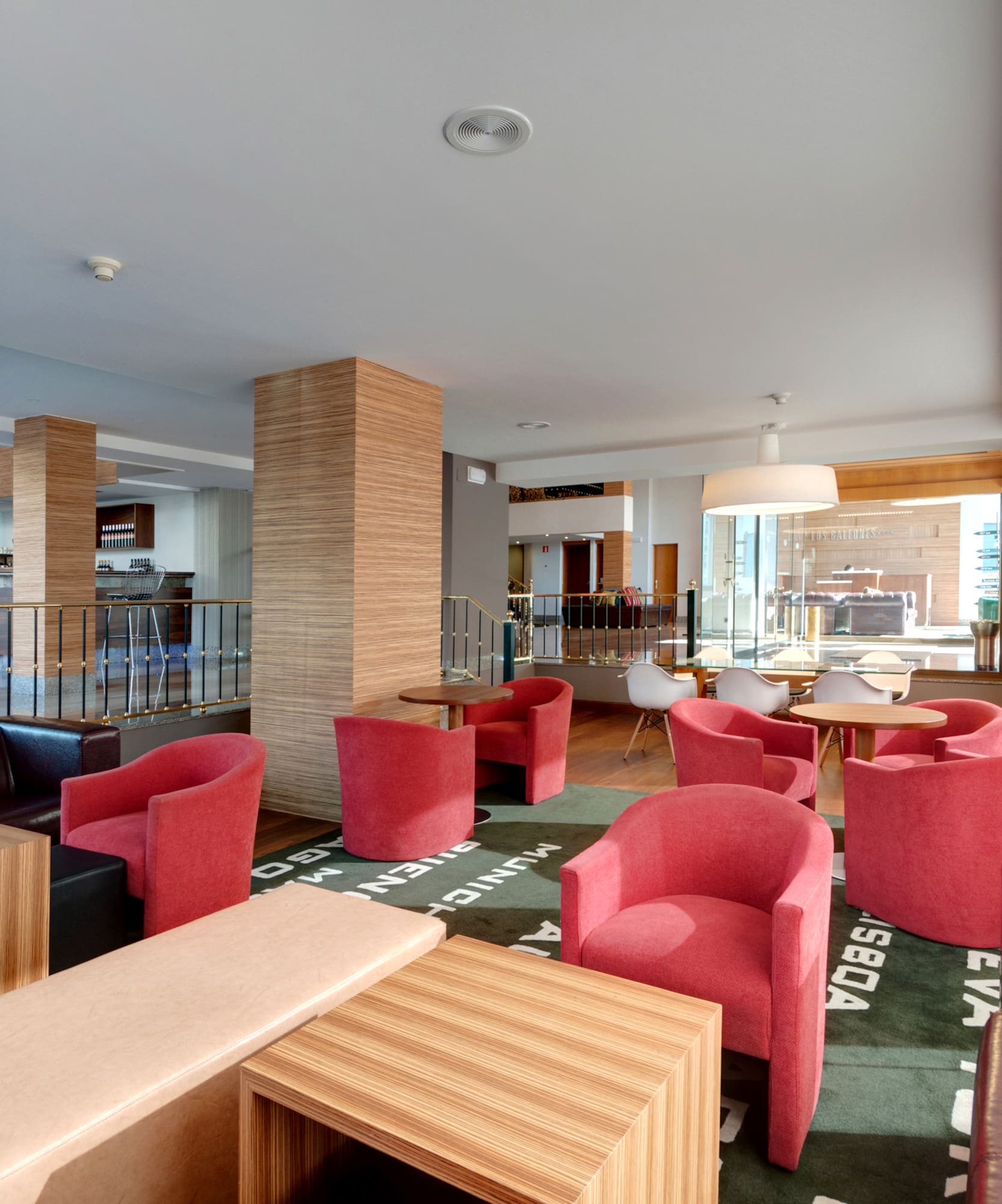 a room with red chairs and tables
