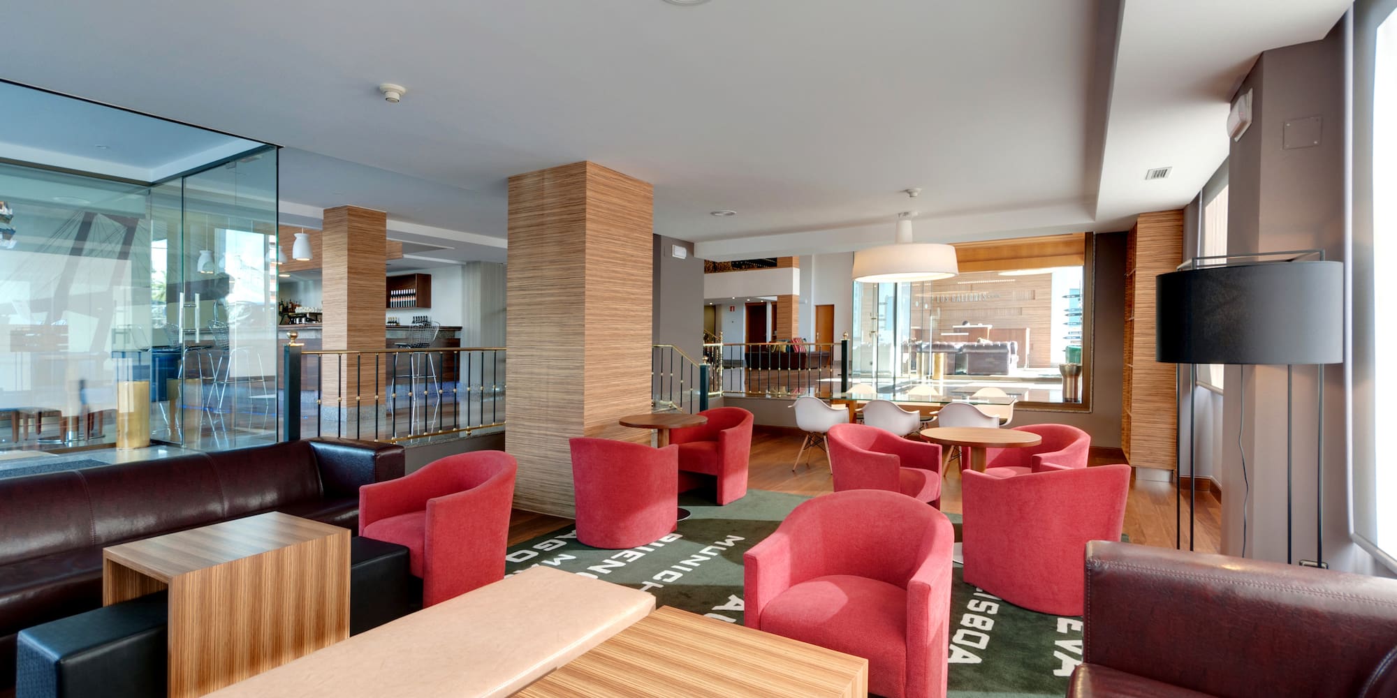 a room with red chairs and tables