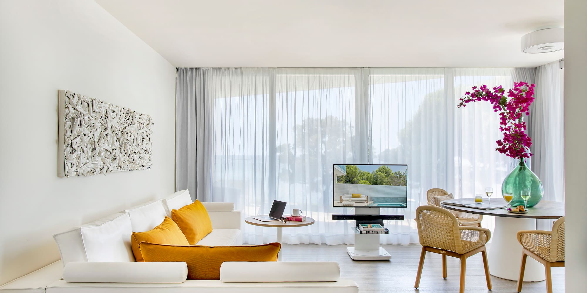 a living room with a table and chairs