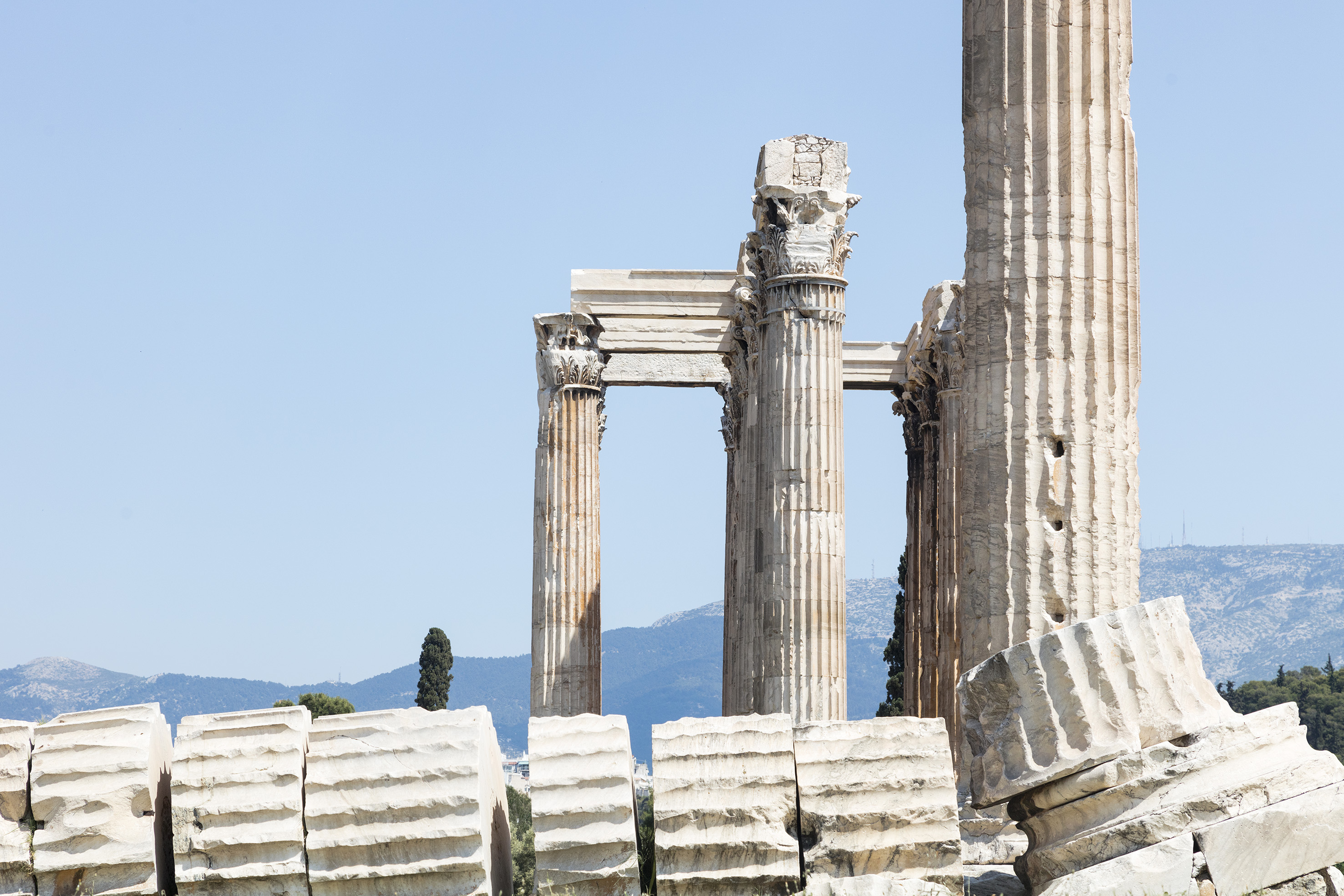 Corinthian columns and fallen stone blocks at the Temple of Olympian Zeus, Athens.