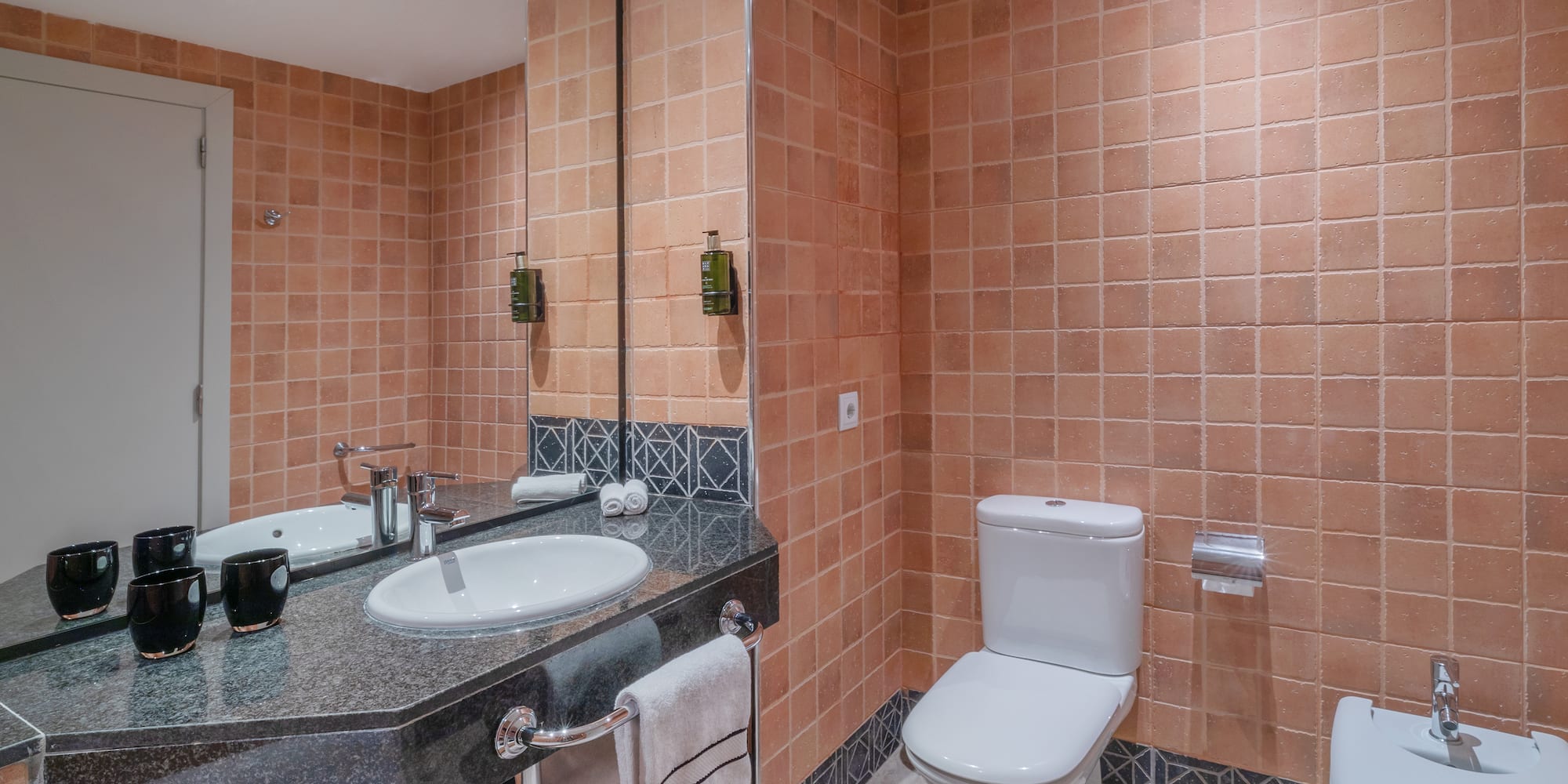 a bathroom with a sink and toilet