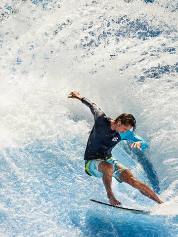 a man surfing on a wave