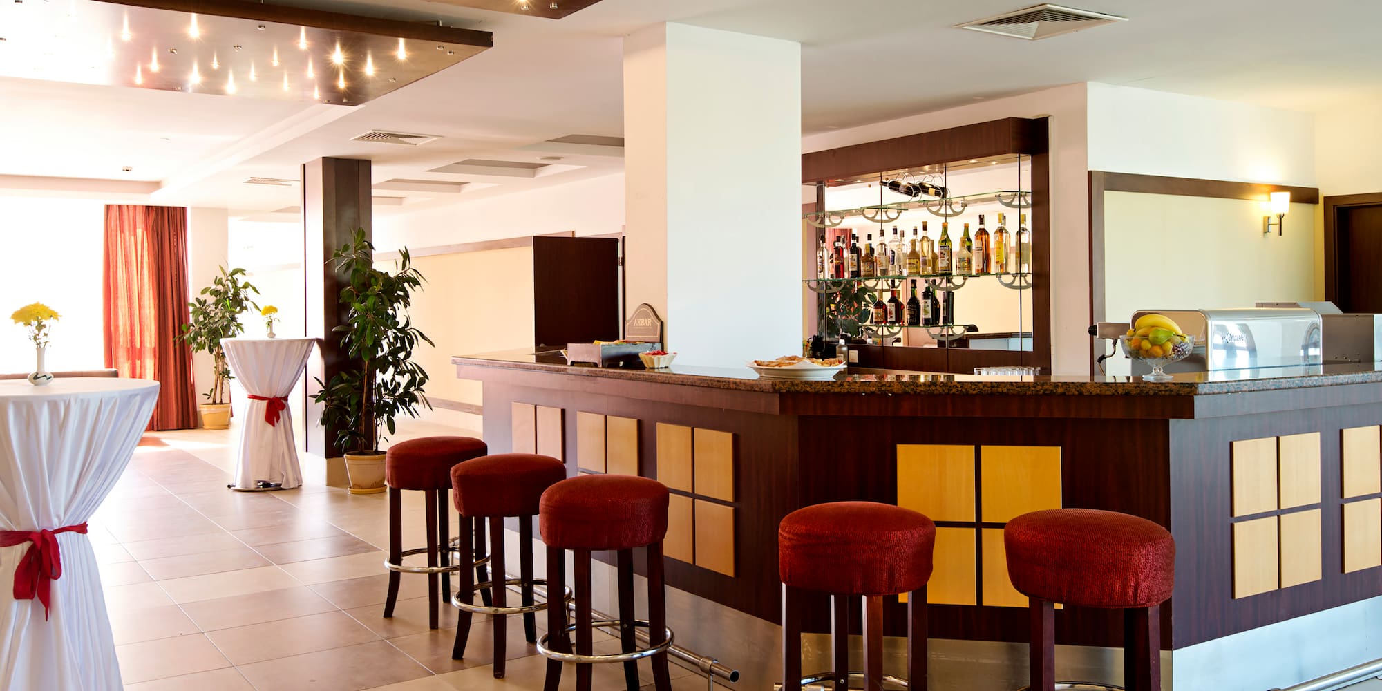 a bar with stools in a room