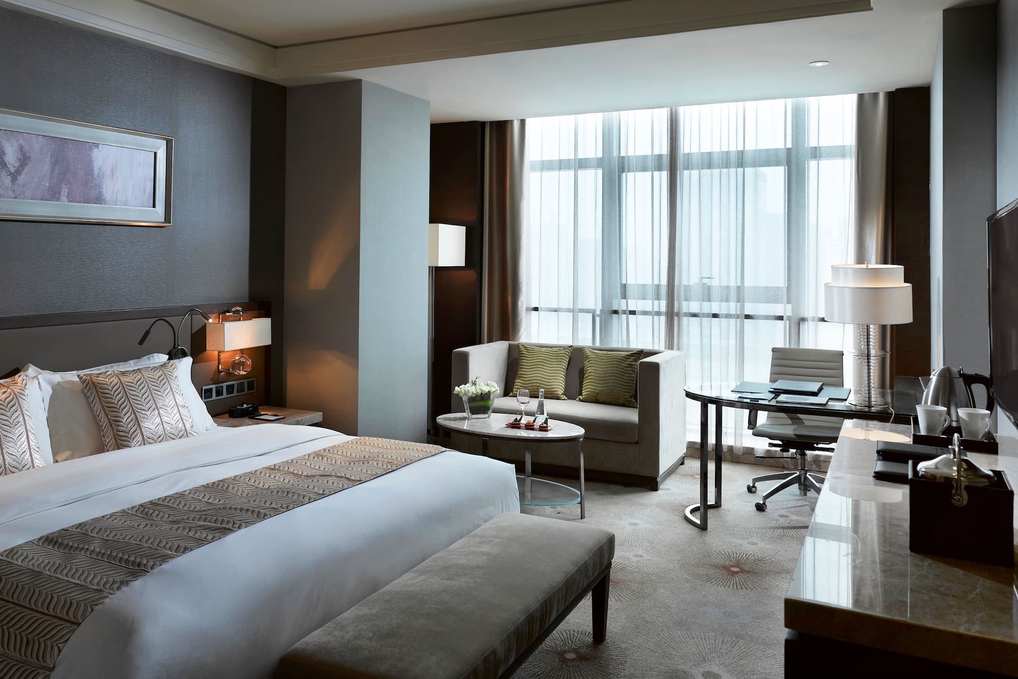 a hotel room with a bed and a table