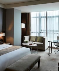 a hotel room with a bed and a table