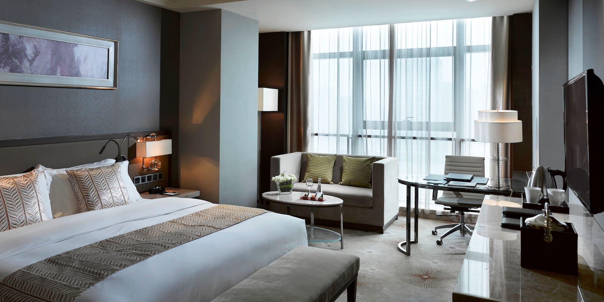 a hotel room with a bed and a table