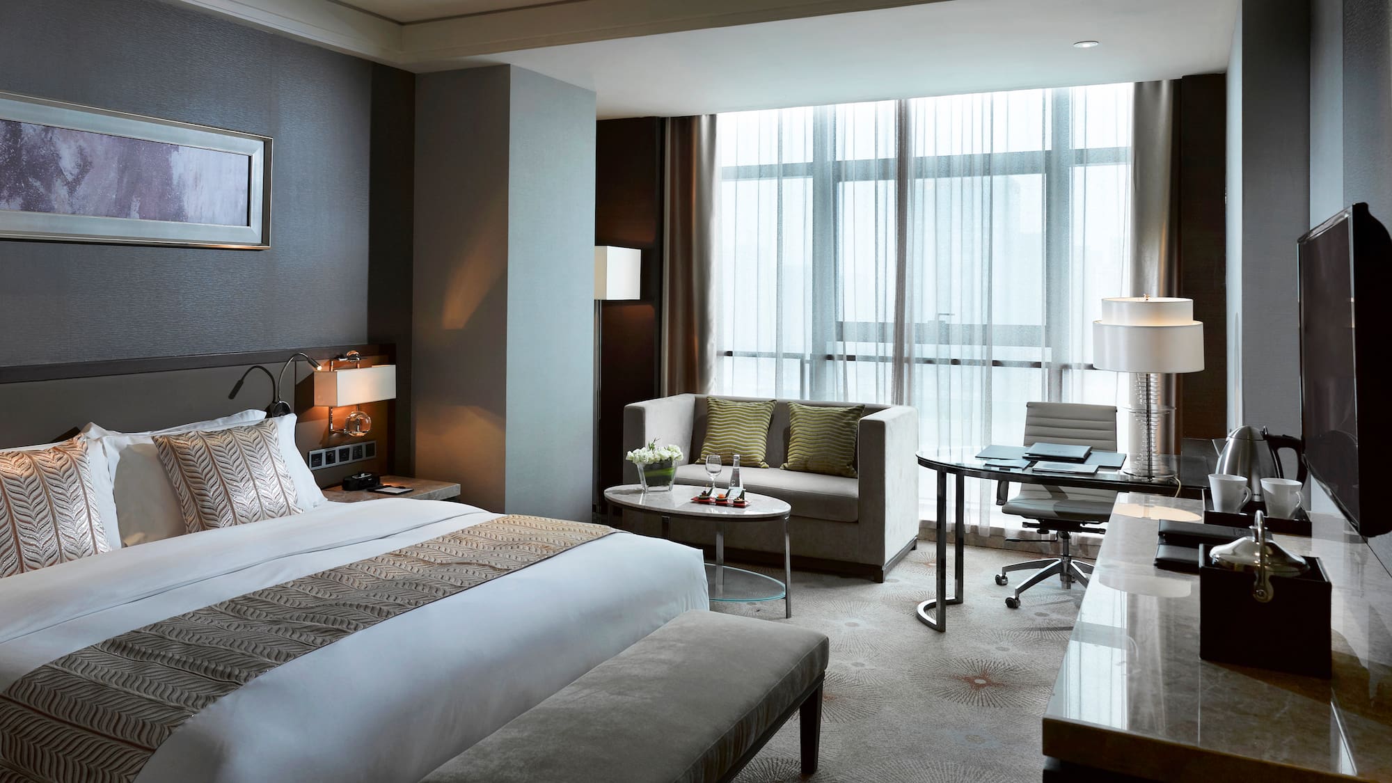 a hotel room with a bed and a table