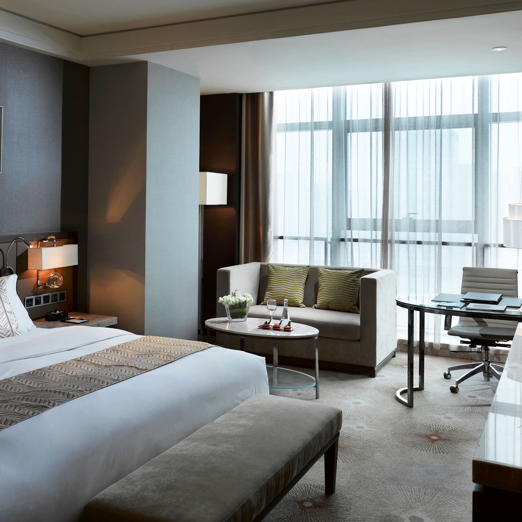 a hotel room with a bed and a table