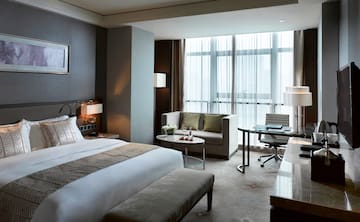 a hotel room with a bed and a table