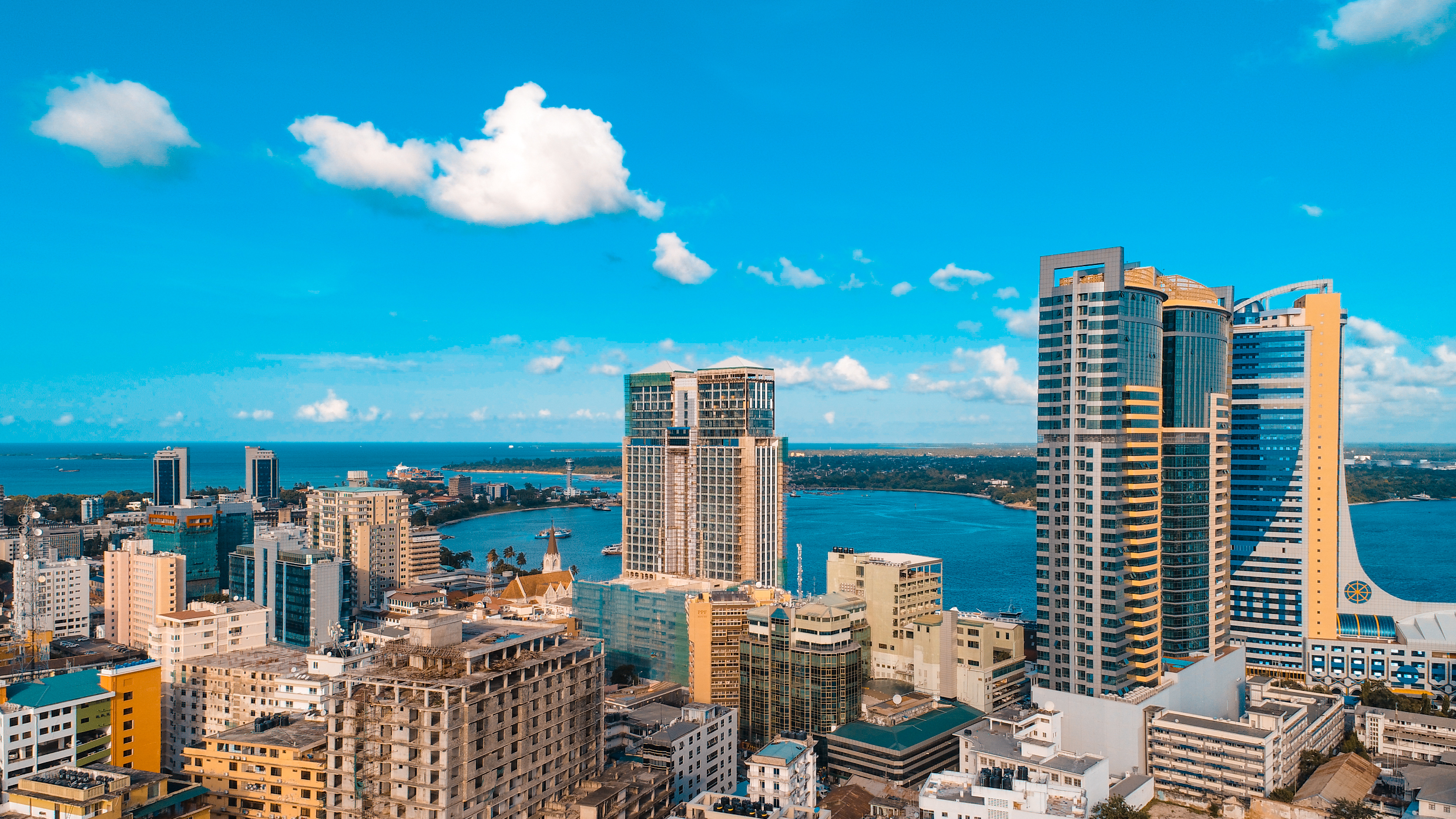 a city with many tall buildings and a body of water