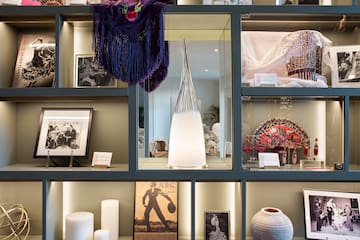 a shelf with pictures and objects on it