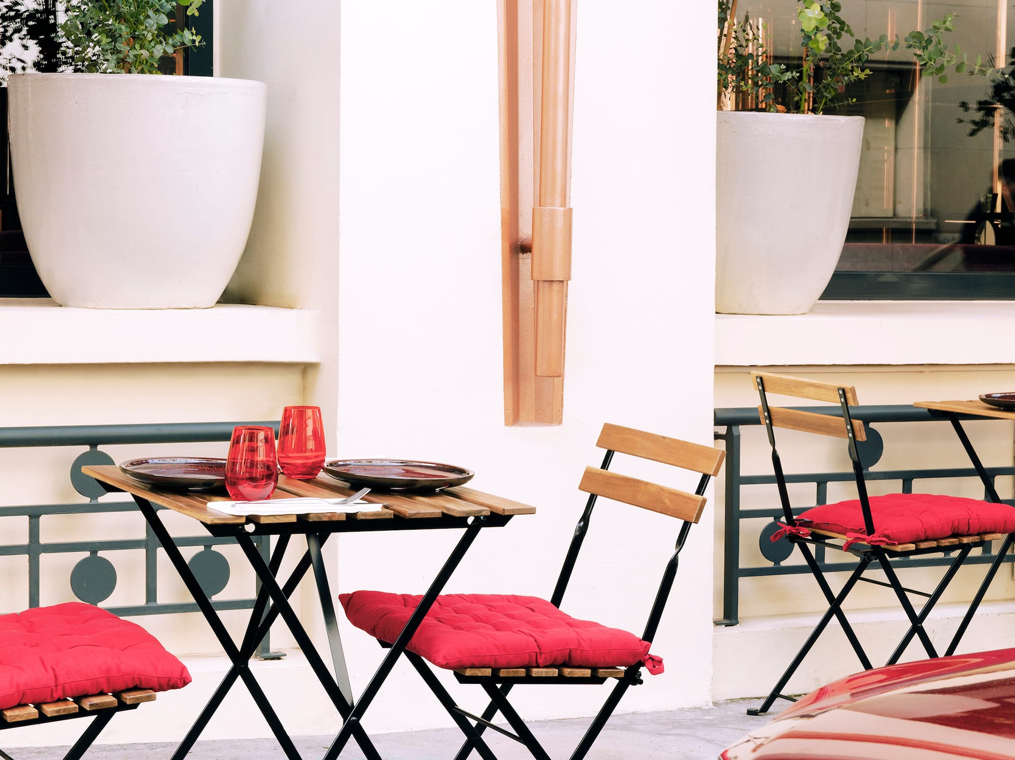 a table and chairs outside a building