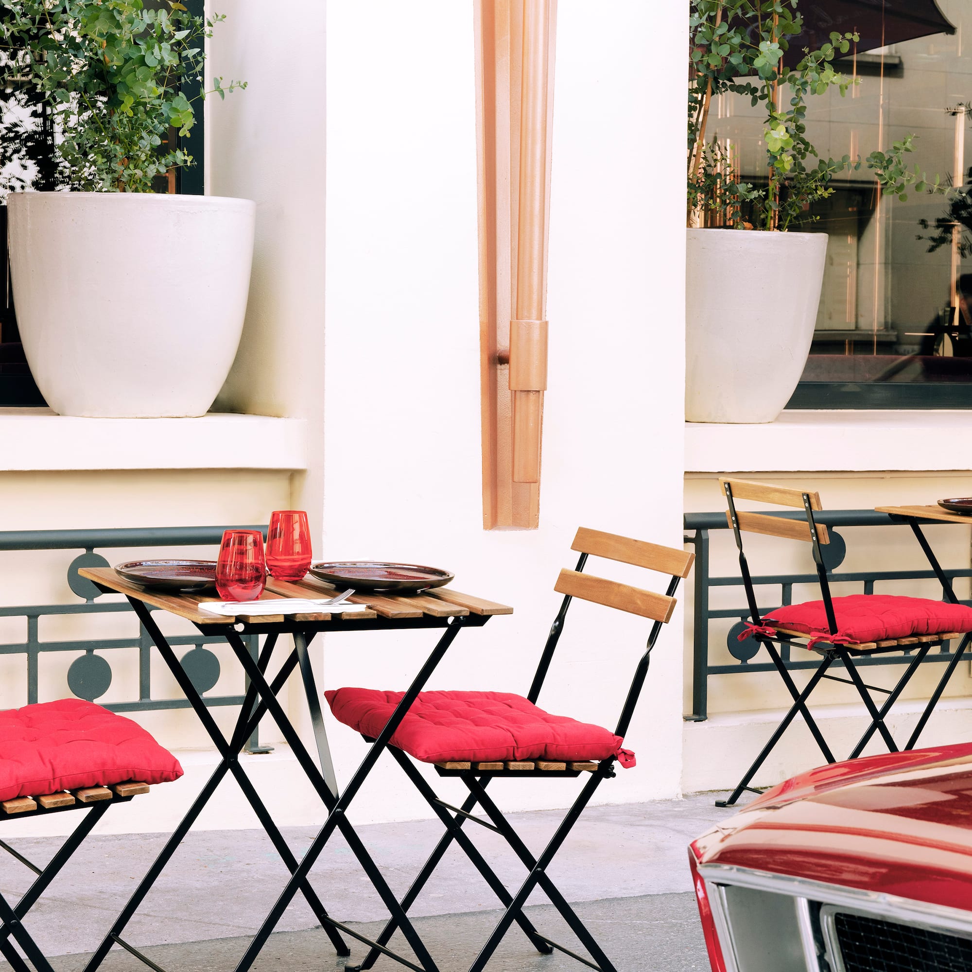 a table and chairs outside a building