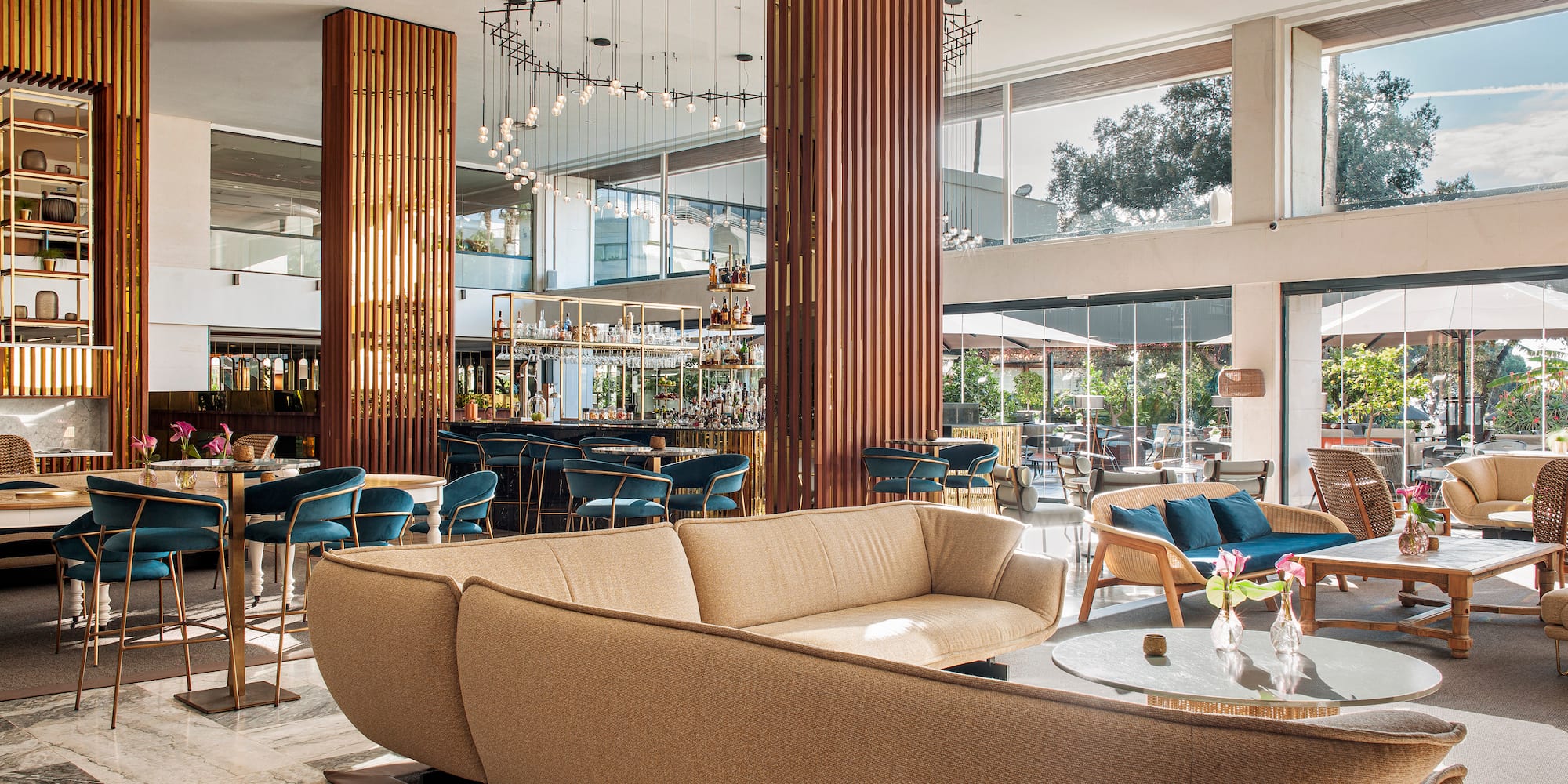 a large room with a large couch and tables