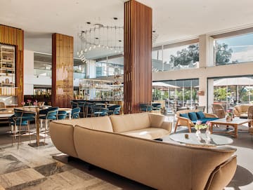 a large room with a large couch and tables