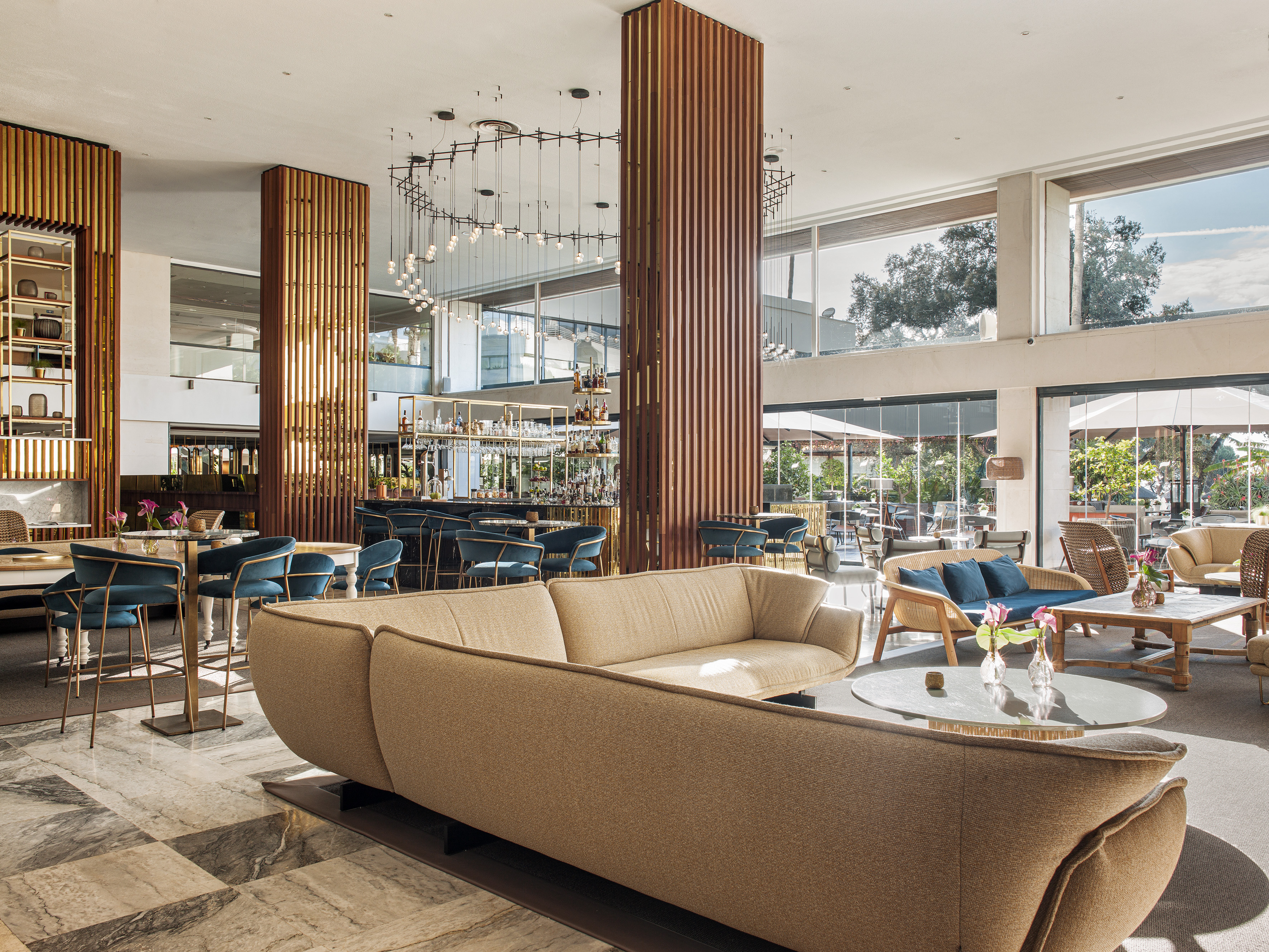 a large room with a large couch and tables