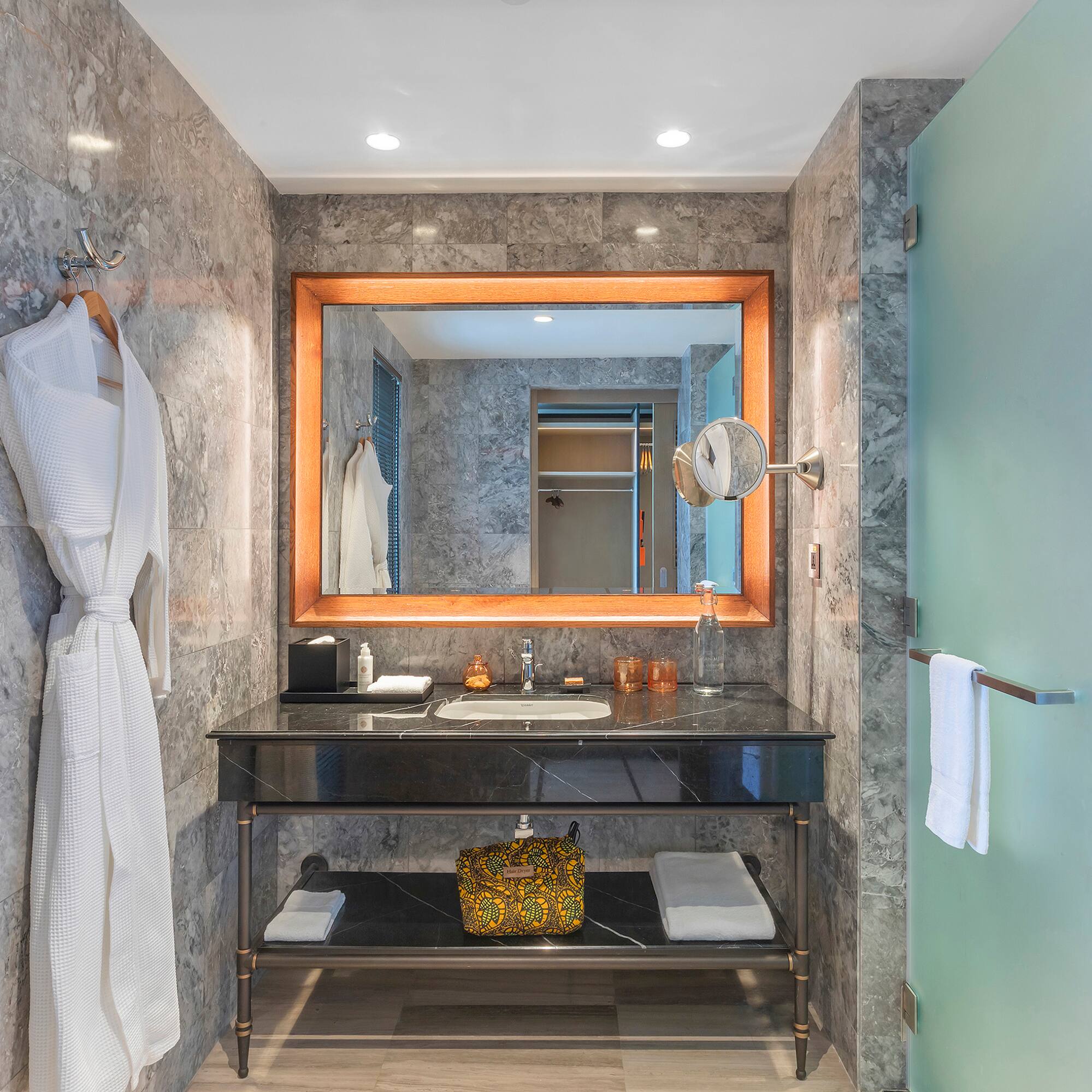 a bathroom with a mirror and a sink