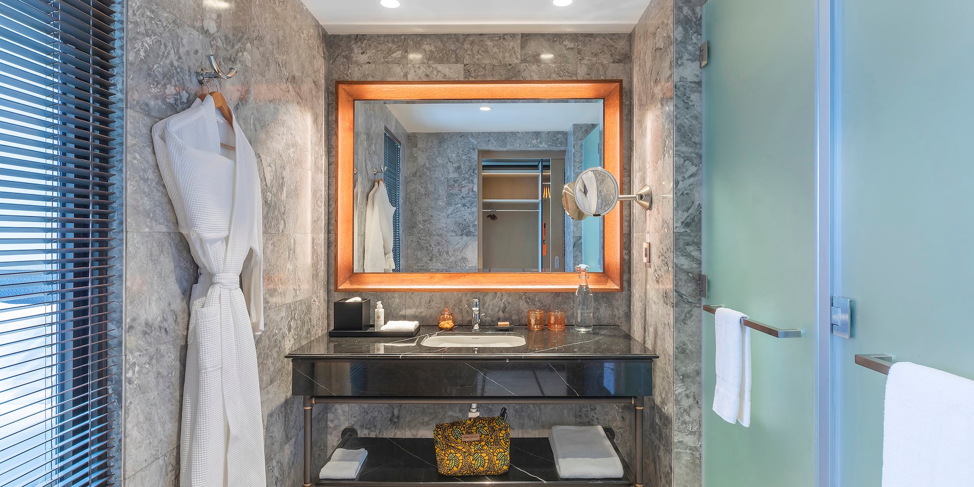 a bathroom with a mirror and a sink