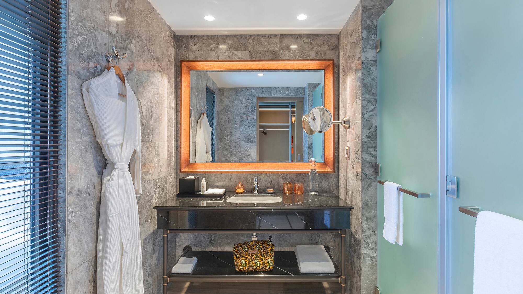 a bathroom with a mirror and a sink