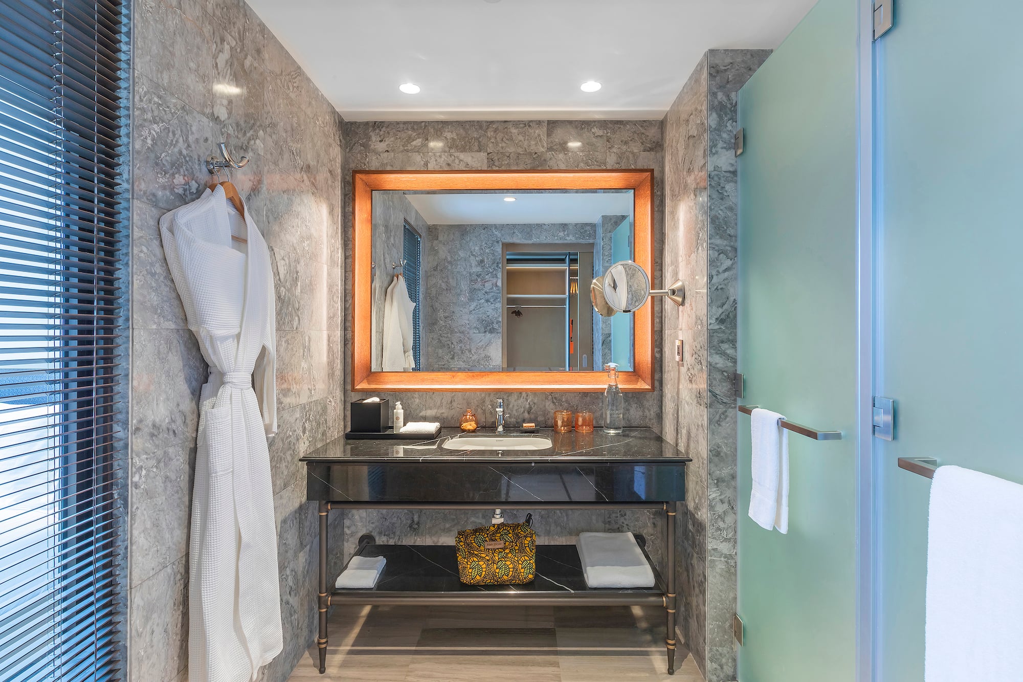 a bathroom with a mirror and a sink