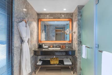 a bathroom with a mirror and a sink