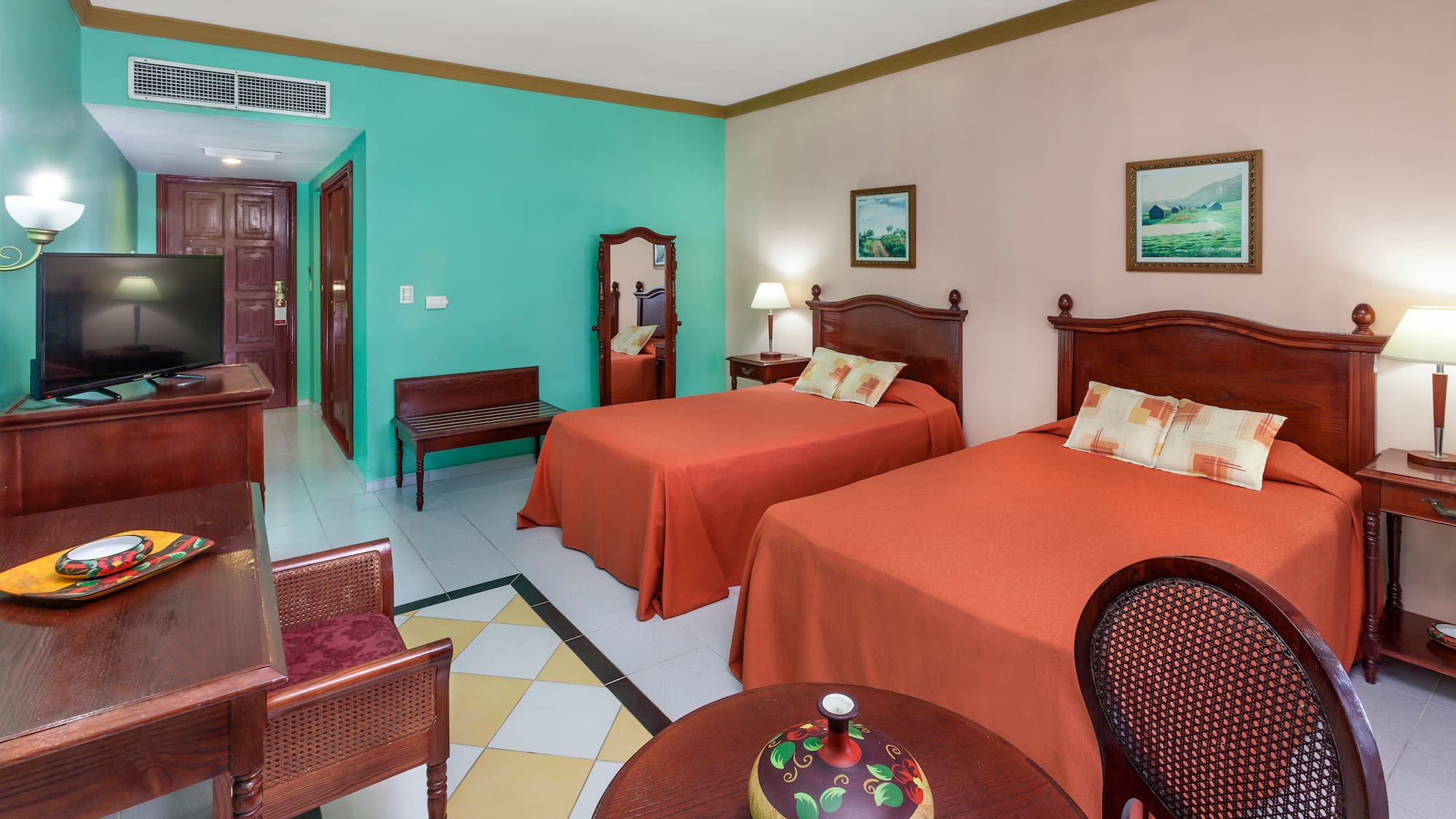 a room with two beds and a table