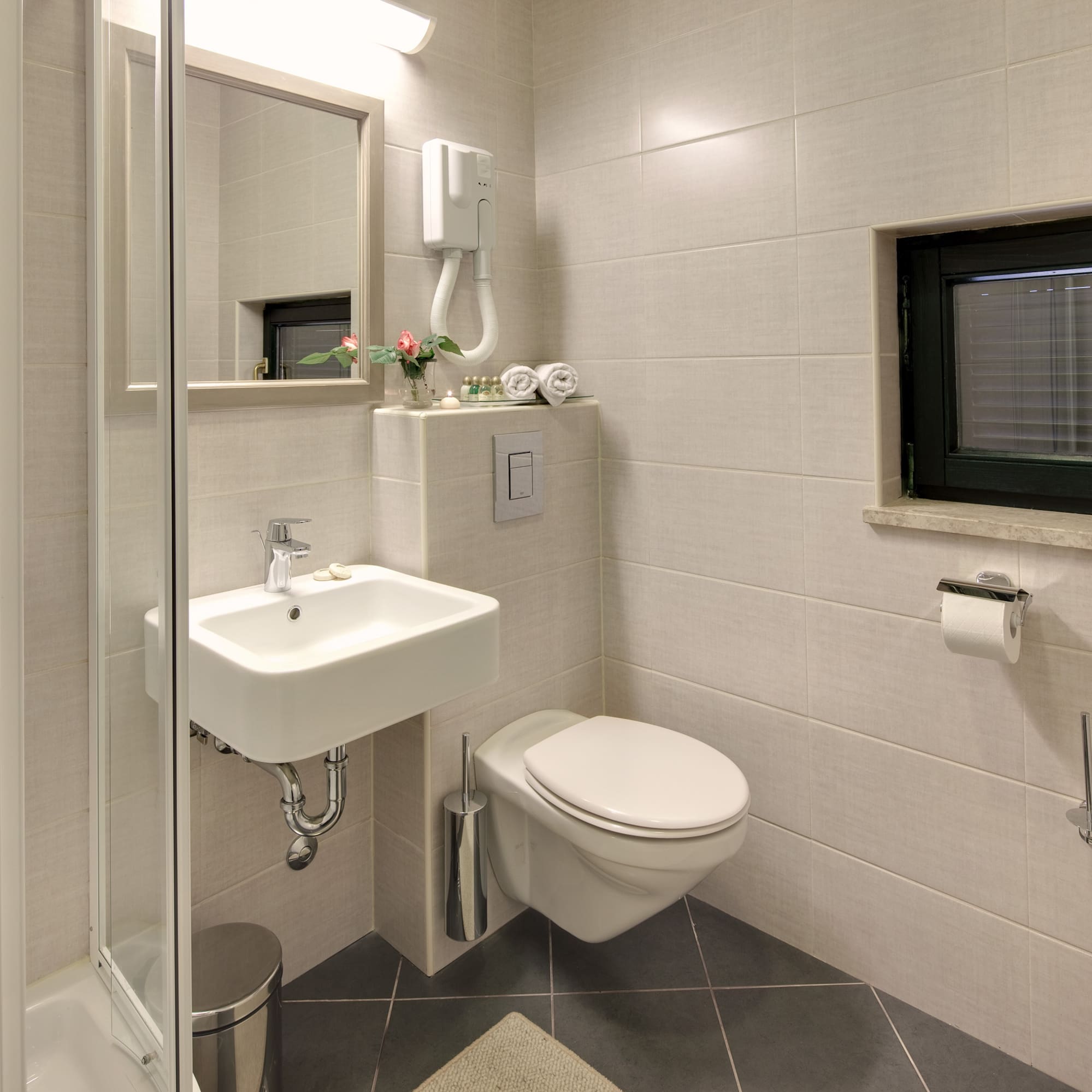 a bathroom with a sink and toilet