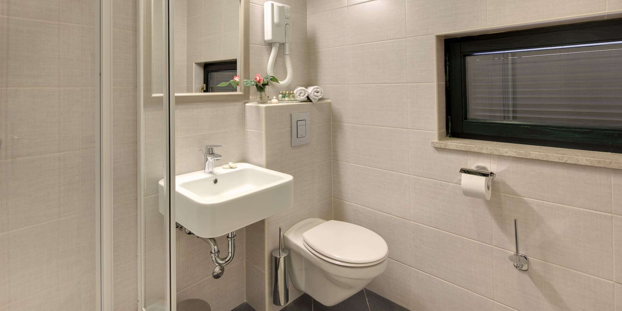 a bathroom with a sink and toilet