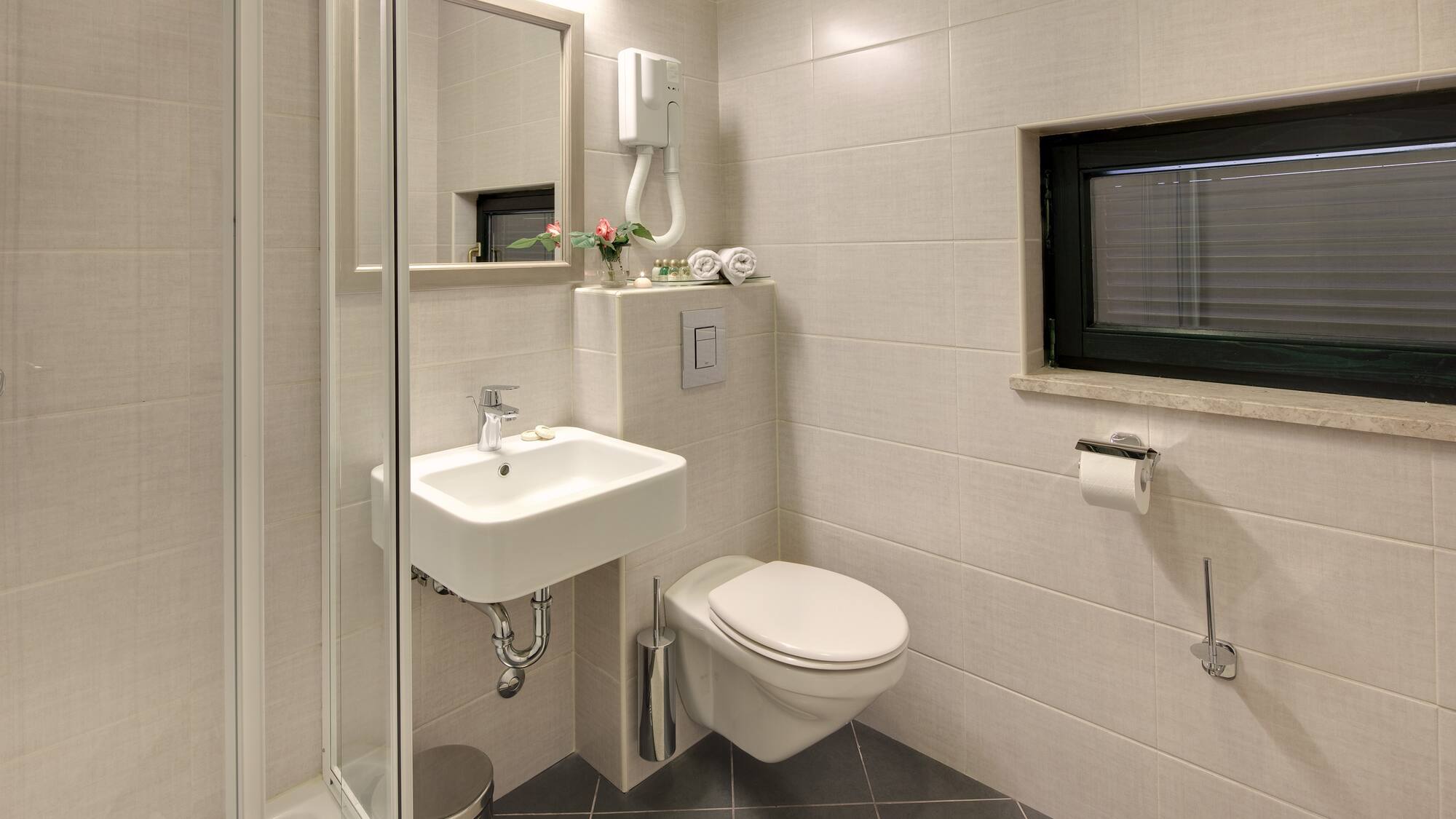 a bathroom with a sink and toilet