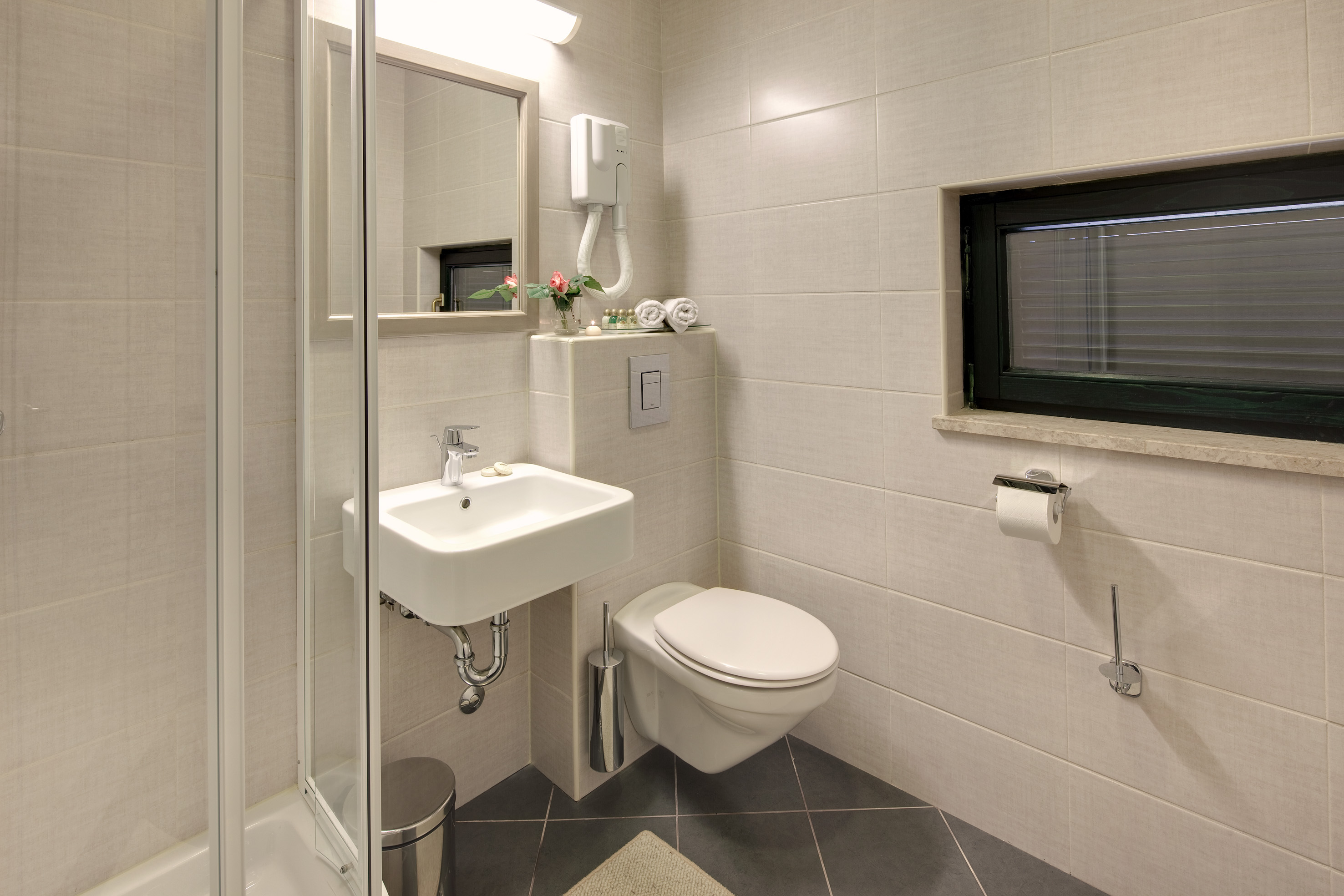 a bathroom with a sink and toilet