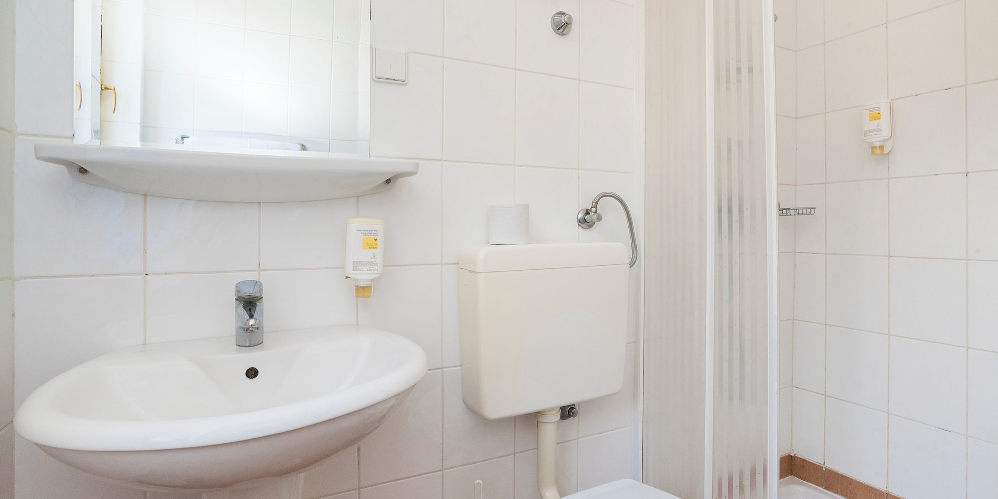 a bathroom with a toilet and sink
