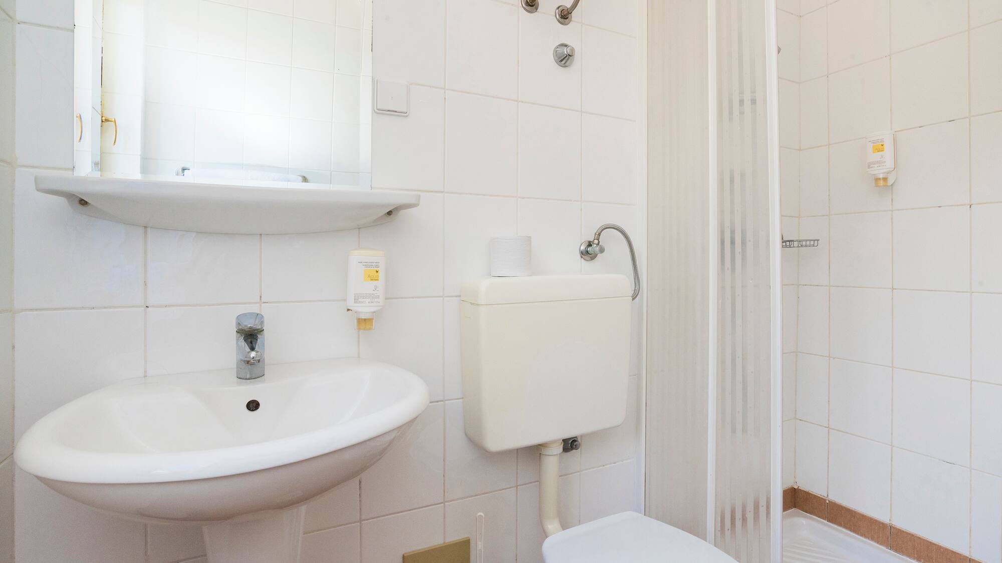 a bathroom with a toilet and sink
