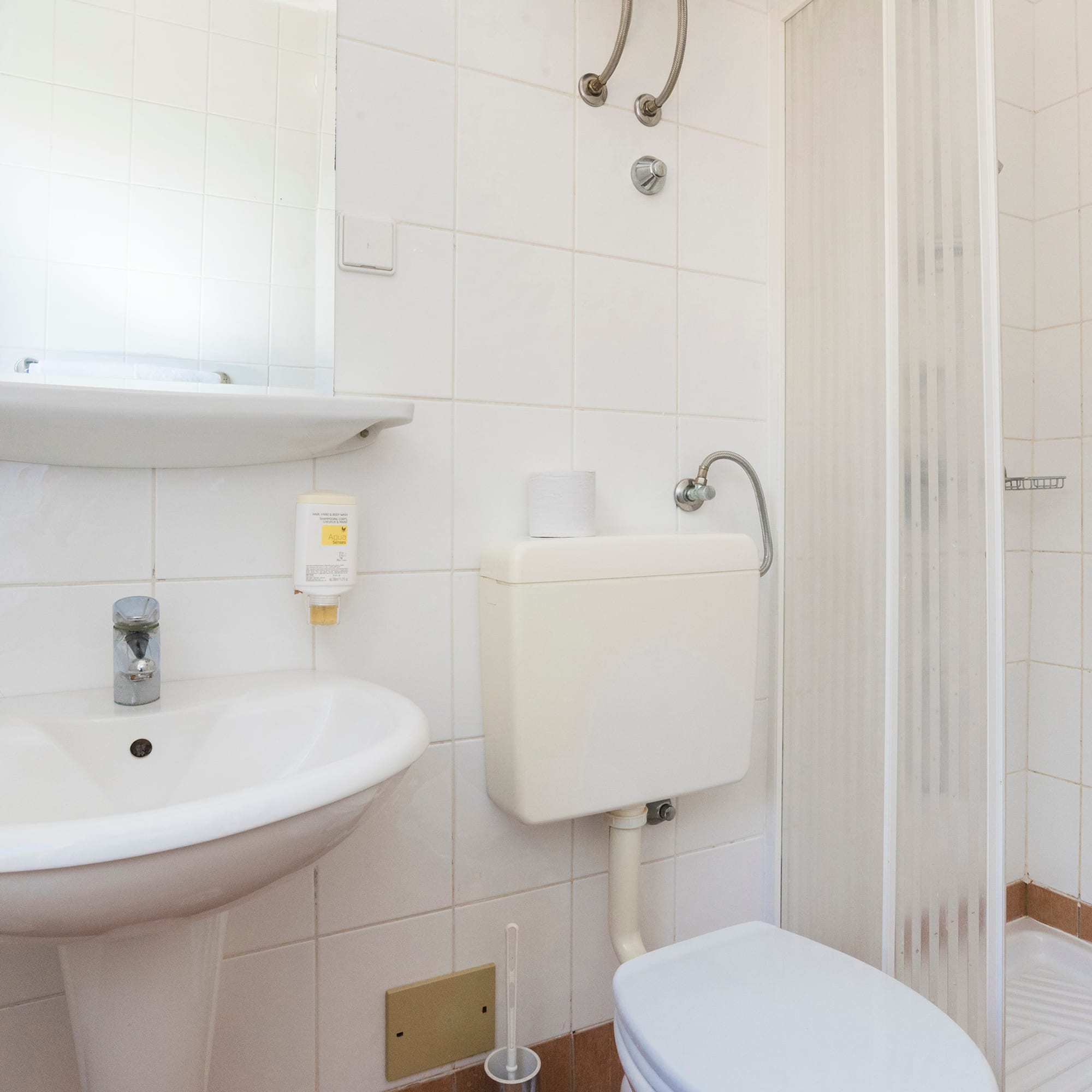 a bathroom with a toilet and sink