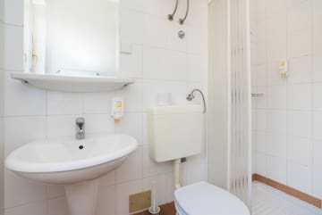 a bathroom with a toilet and sink