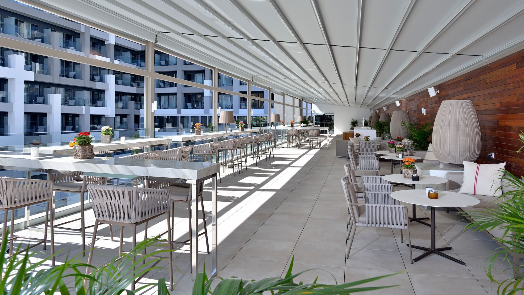 a long room with tables and chairs