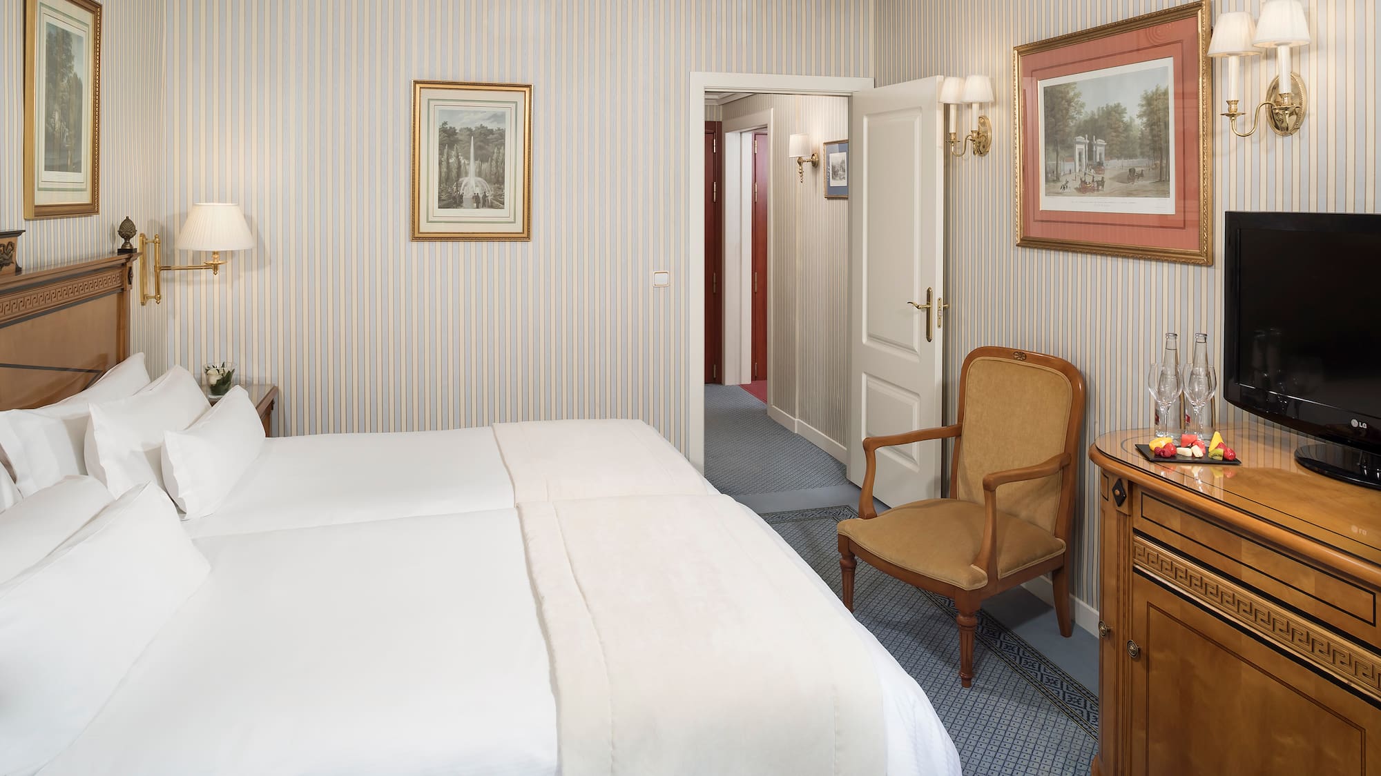 a bedroom with a bed and a chair