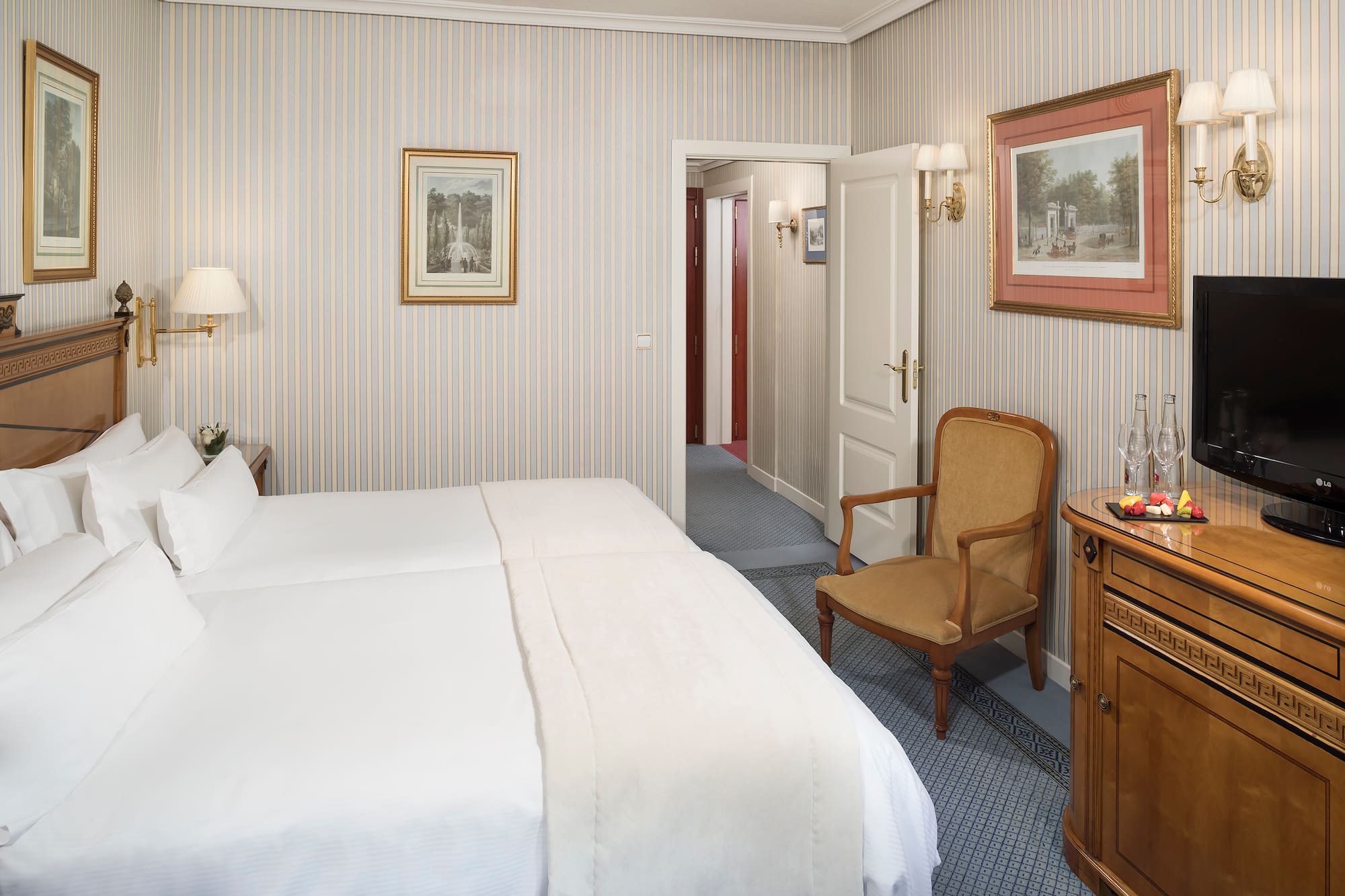 a bedroom with a bed and a chair