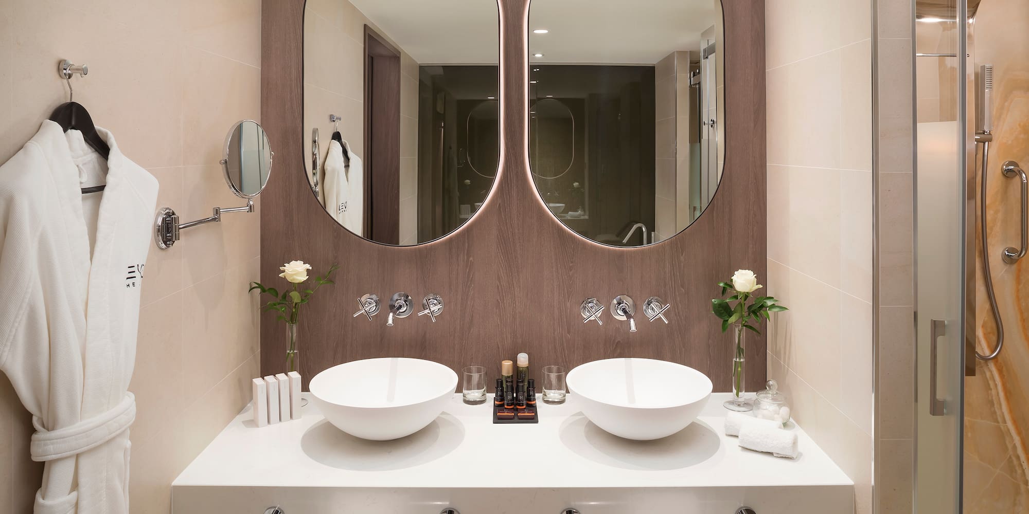 a bathroom with two sinks and mirrors